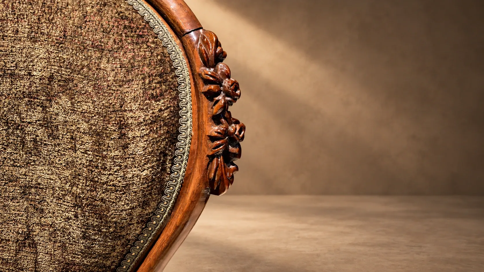 Carved frame running down the armchair back