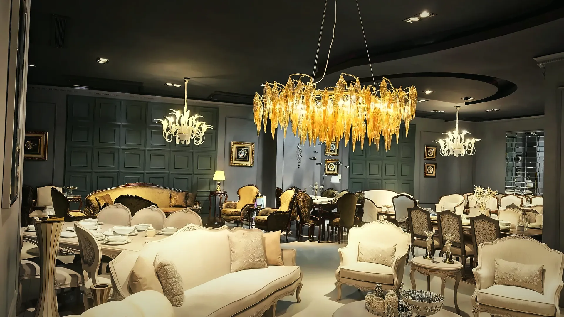 The gallery under the amber chandelier